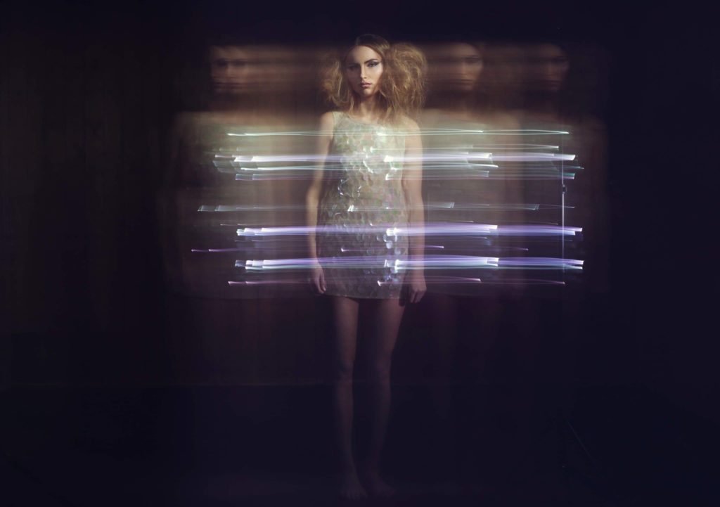 fashion model photographed with blue light trails at a fashion photography workshop in London