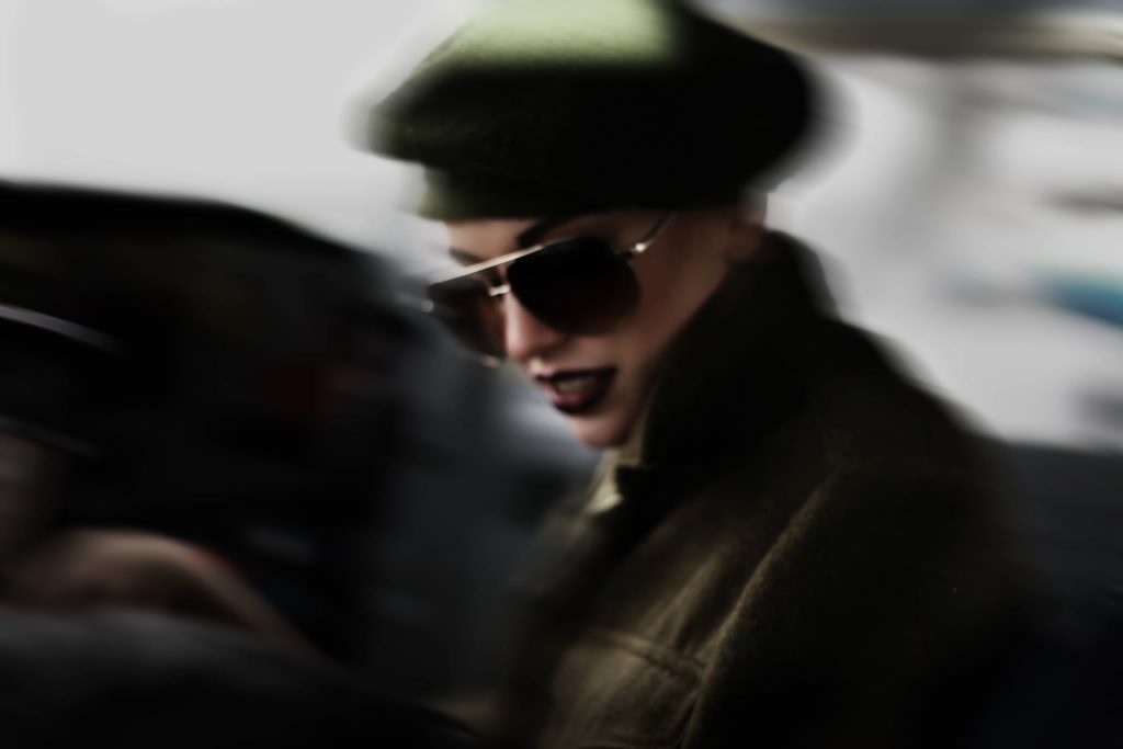 woman in green beret at fashion photography workshop in London